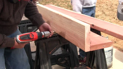 Man drilling board Stock Footage 22823540