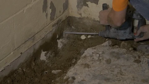 Man Drilling Hole in Block Wall Left Side Stock-Footage 100697541