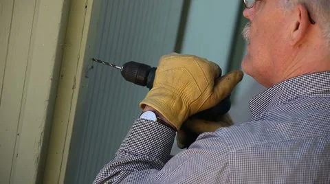 Man drilling a hole Stock Footage 5297945
