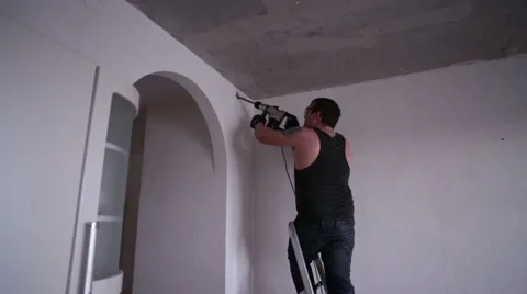 Man Drilling the Wall  Stock Footage 63656644