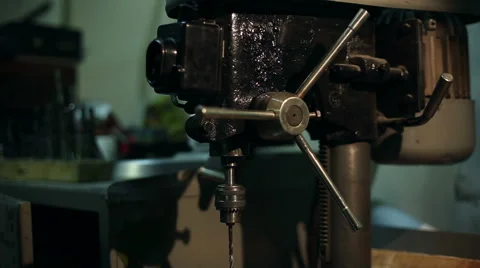 Man drills a detail on a drilling machine Stock Footage 59595768