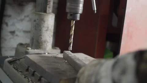 Man drills on a drilling machine Stock Footage 130711009