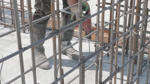 Man drills a hole at a construction site 10.06.2020 Stock Footage 132493392