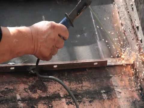Man drills sparks Stock Footage 78222997