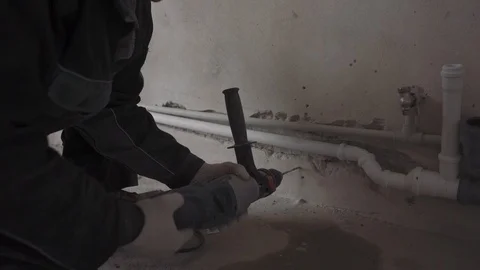 Man drills a wall Stock Footage 101551588