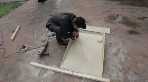 Man drills wood products in skatepark Stock Footage 59242410