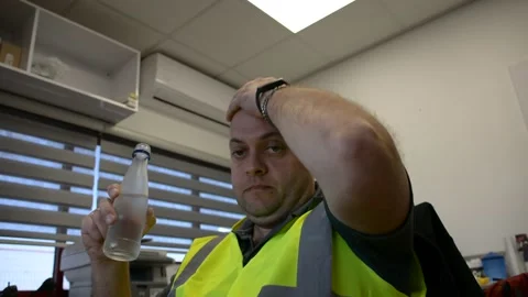 Man drink soda water at work place on factory office Video stock 181112349