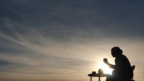 Man drink tea at sunset on beautiful sky background Stock Footage 88708402
