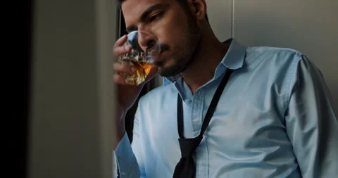 Man drinking alcohol to relieve depressed and stressed with problems in his life Stock Footage 246478438
