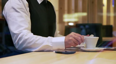 Man drinking and reading newspaper in the restaurant, steadycam shot Stock Footage 44189358