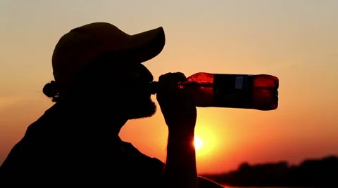 Man drinking beer and smoking a cigarette. Stock Footage 40434388