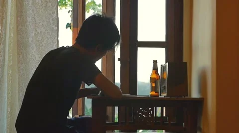 Man drinking beer and working  in chill mood. Stock Footage 56332949