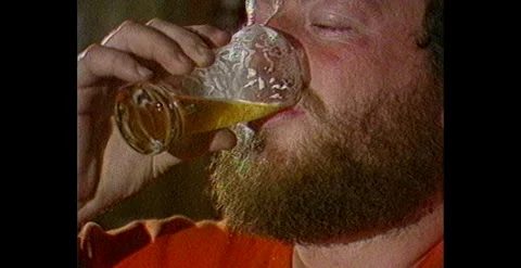 Man Drinking Beer in Australian Pub – Interior View (1983) Video stock 310484245