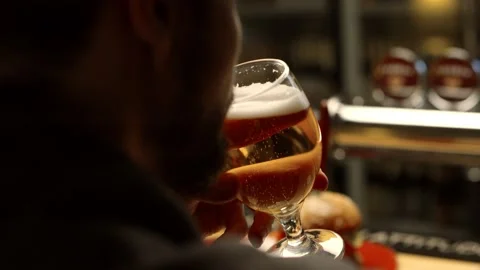 A man drinking beer in a bar Stock Footage 153159208