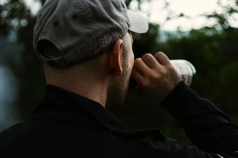 Man drinking beer from a bottle Stock Photos