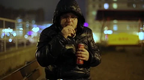 Man Drinking Beer With Chips On Street Video stock 63603853