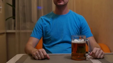 Man drinking beer. Cold light beer. Craft beer. A pint of light beer Stock Footage 96196168