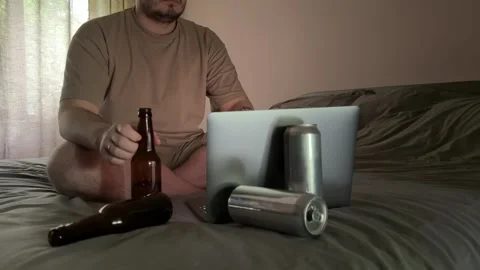 Man Drinking Beer in Dark Room with Laptop Stock-Footage 310511397