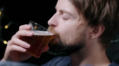 Man drinking beer from a glass Video stock 132845379