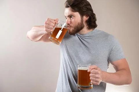 Man Drinking Beer Isolated On Light Gray Background Stock Photos