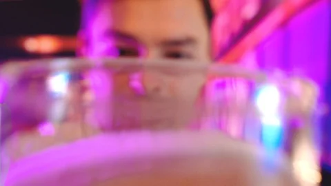 Man Drinking Beer At modern interior Bar Or Pub background with Cool Neon Lights Stock Footage 101914786