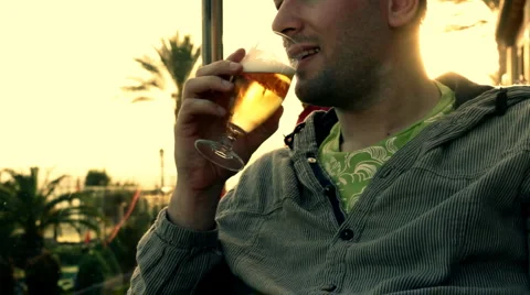 Man drinking beer, outdoors Stock Footage 1051020