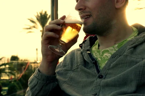 Man drinking beer, outdoors Stock Footage 1051062
