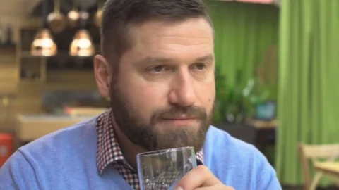 Man drinking beer, portrait, in pub, cafe, indoor, close steadicam shot Vídeos de archivo 73067410