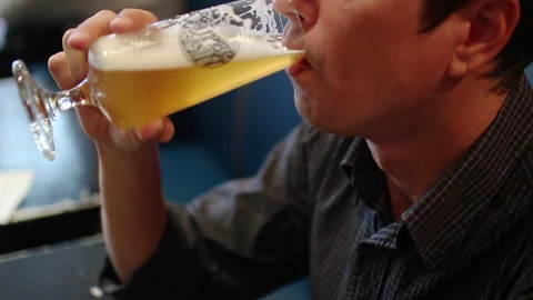 Man Drinking Beer From Stemmed Glass Close Up Stock Footage 344682287