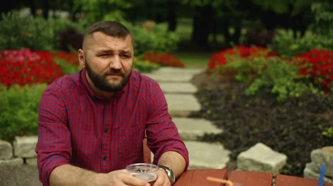 Man is drinking beer at the table Stock Footage 65811411