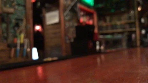 Man drinking black beer in a bar. Blur. defocus Video stock 108667986