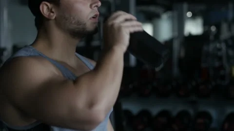 Man is drinking bodybuilding supplement Video stock 85616811