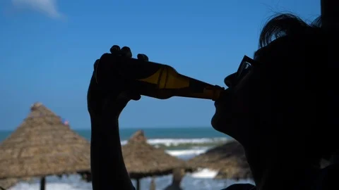 Man Drinking Bottle Of Beer Stock Footage 120332051