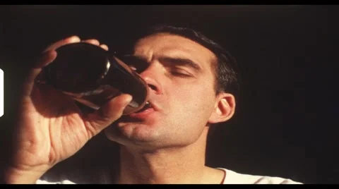 Man drinking bottle of beer (vintage 8 mm amateur film) Stock Footage