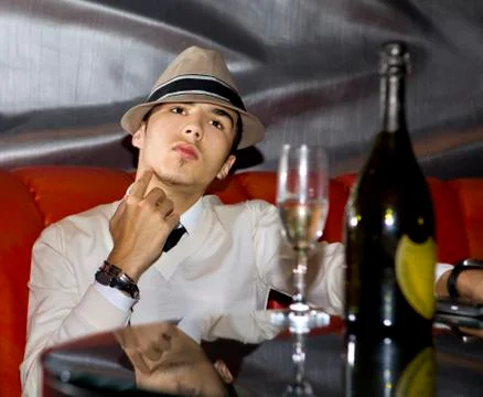 Man drinking champagne Stock Photos