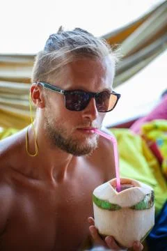 Man drinking coconut Stock Photos