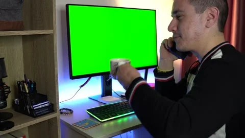 Man is Drinking Coffe and Talking on the Phone Green Screen Stock Footage 194244742