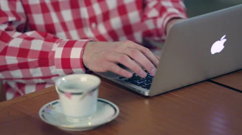 Man drinking coffee and sitting at the laptop Stock Footage 48570630