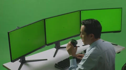 Man Drinking Coffee And Working With Mock Up Multiple Computer Monitor Stock Footage 249634530