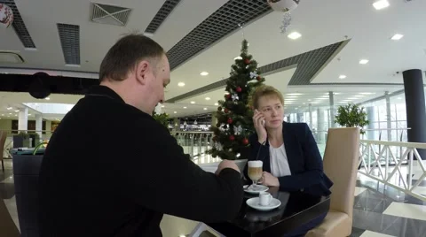 Man drinking coffee. In the background a Christmas tree. 動画素材 58685175