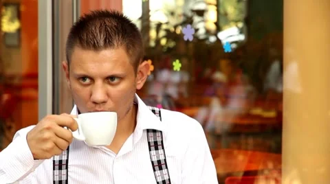 Man drinking coffee in cafe Stock Footage 8607170