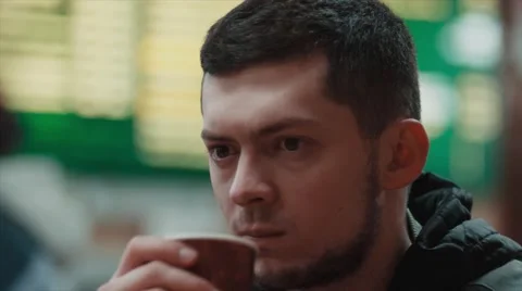 Man drinking coffee in cafe Stock Footage 61865368