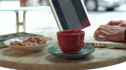 Man drinking coffee in cafe while using laptop Stock Footage 46159508