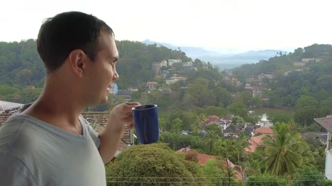 Man Drinking Coffee with City View in Kandy Stock Footage 73259064