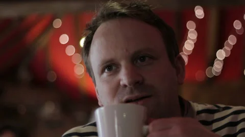 Man drinking coffee in cool cafe CU 库存影片 35191182