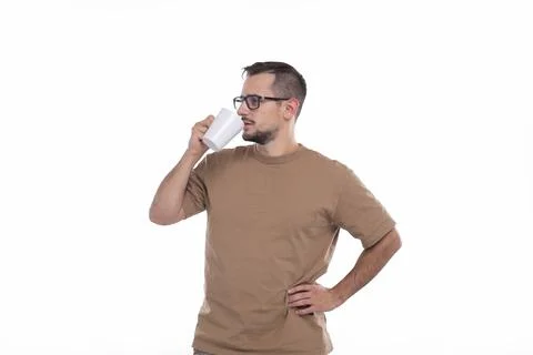 Man Drinking Coffee from Cup. Man With Cup in Hands. Stock Photos