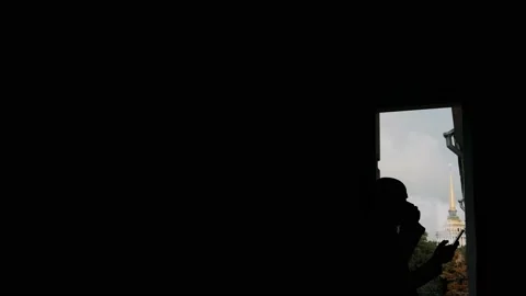 Man drinking coffee near the window Stock Footage 238374700