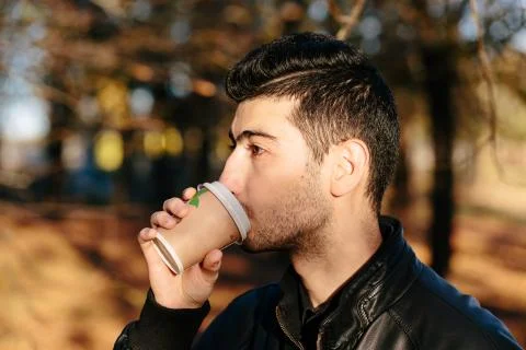Man drinking coffee in the park Stock Photos