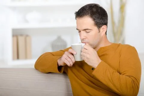 A man is drinking coffee Stock Photos