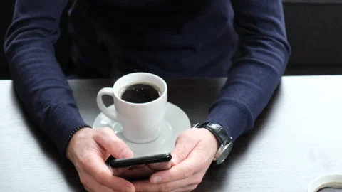 Man drinking coffee at the table. selective focus. Stock Footage 147945390